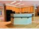 Eat-in kitchen boasts custom wood cabinetry, granite countertops, and stainless-steel appliances at 1512 Cumberland Rd, Chapel Hill, NC 27514
