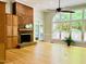 Spacious living room with hardwood floors, a brick fireplace, and large windows at 1512 Cumberland Rd, Chapel Hill, NC 27514