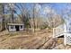 Expansive backyard with a charming shed, mature trees, and potential for outdoor enjoyment at 1536 Maybrook Dr, Raleigh, NC 27610
