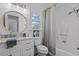 Bathroom featuring a white vanity, light fixtures and a tub/shower combo at 1536 Maybrook Dr, Raleigh, NC 27610
