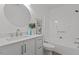 Bathroom featuring a white vanity, light fixtures and a tub/shower combo with shower curtain at 1536 Maybrook Dr, Raleigh, NC 27610