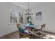 Bright dining room with natural light, modern lighting, and seating for four around a glass table at 1536 Maybrook Dr, Raleigh, NC 27610