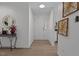 Bright entryway with neutral walls, console table, and decorative mirror and artwork at 1536 Maybrook Dr, Raleigh, NC 27610