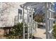 Inviting front entrance featuring an elegant white pergola and well-maintained landscaping at 1536 Maybrook Dr, Raleigh, NC 27610