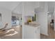 Hallway showing a view of the outside balcony, white walls and light colored floors at 1536 Maybrook Dr, Raleigh, NC 27610