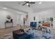 Cozy living room space showcasing a stylish rug, modern fireplace, and open access to the dining area at 1536 Maybrook Dr, Raleigh, NC 27610