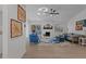 Bright living room with modern fireplace, hardwood floors, and sliding door access to a deck at 1536 Maybrook Dr, Raleigh, NC 27610