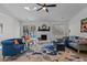 Inviting living room featuring a fireplace, ceiling fan, and access to a deck with outdoor seating at 1536 Maybrook Dr, Raleigh, NC 27610
