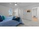 Bright and open main bedroom features carpet, light colored walls, and ensuite bathroom at 1536 Maybrook Dr, Raleigh, NC 27610