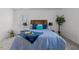 Bright main bedroom with a king bed and dark wood headboard and white walls at 1536 Maybrook Dr, Raleigh, NC 27610