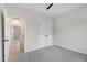 Bedroom featuring neutral carpet, a ceiling fan, closet and views into other rooms at 162 Gumtop Dr, Zebulon, NC 27597