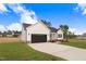 View of the front of a single-story home with a driveway and lawn at 162 Gumtop Dr, Zebulon, NC 27597