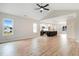 Bright open-concept living area flows into a modern kitchen with an island and stainless steel appliances at 162 Gumtop Dr, Zebulon, NC 27597