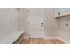 Mudroom with built-in bench and storage near the garage entrance, providing organized space at 162 Gumtop Dr, Zebulon, NC 27597