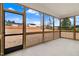 Covered screened-in porch with wood frame and view of backyard at 162 Gumtop Dr, Zebulon, NC 27597