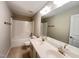 This bathroom features a double vanity, shower, and tile flooring at 1746 Hammocks Beach Trl, Apex, NC 27502