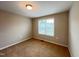 Bedroom featuring carpet flooring, neutral walls, a single window at 1746 Hammocks Beach Trl, Apex, NC 27502