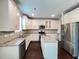 Modern kitchen with granite countertops, stainless steel appliances, and a center island at 1746 Hammocks Beach Trl, Apex, NC 27502