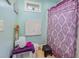 Compact bathroom featuring a patterned shower curtain, neutral flooring and bright lighting at 1770 Gentry Ridge Rd, Roxboro, NC 27574