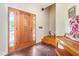 Foyer featuring a wooden front door with glass panes and hardwood floors at 1770 Gentry Ridge Rd, Roxboro, NC 27574