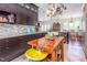Spacious kitchen features a center island, breakfast bar, and dark wood cabinets at 1770 Gentry Ridge Rd, Roxboro, NC 27574