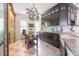 Bright kitchen with tile floors, dark wood cabinets and copper hardware at 1770 Gentry Ridge Rd, Roxboro, NC 27574