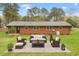 Charming brick home with a cozy patio seating area and landscaped backyard, perfect for outdoor entertaining at 1813 Grady Dr., Durham, NC 27712