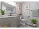 Modern bathroom with a gray vanity, sleek mirror, and stylish decor at 1813 Grady Dr., Durham, NC 27712