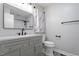 Clean and modern bathroom with a vanity, a shower/tub, and minimalist decor, creating a serene and functional space at 1813 Grady Dr., Durham, NC 27712