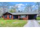 Charming brick home featuring a carport and well-maintained front yard, perfect for comfortable suburban living at 1813 Grady Dr., Durham, NC 27712