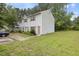 View of a two-story home with light blue siding, brown shutters, and a well-maintained lawn at 1824 Vintage Rd, Raleigh, NC 27610