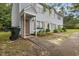 A charming two-story home with light blue siding, brown shutters, and a welcoming front entrance at 1824 Vintage Rd, Raleigh, NC 27610