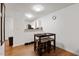 Kitchenette features modern barstool seating area, sleek floors, and neutral paint at 1824 Vintage Rd, Raleigh, NC 27610