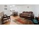 Inviting living room with stylish laminate flooring, comfortable seating, and modern décor at 1824 Vintage Rd, Raleigh, NC 27610