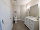Well-lit bathroom with a clean vanity, tile flooring, and modern fixtures for convenience at 186 St. Andrews Ln, Chapel Hill, NC 27517