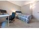 Cozy carpeted bedroom with desk, chair and ample light at 186 St. Andrews Ln, Chapel Hill, NC 27517