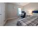 Comfortable bedroom featuring a desk area, soft carpet, and natural light for a cozy feel at 186 St. Andrews Ln, Chapel Hill, NC 27517