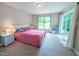 Bright, carpeted bedroom with a sliding glass door and large window at 186 St. Andrews Ln, Chapel Hill, NC 27517