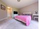 Spacious bedroom with plush carpet, light-colored walls, and a vanity for added comfort at 186 St. Andrews Ln, Chapel Hill, NC 27517