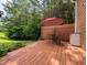 Relaxing backyard deck with seating and a lush green backdrop, perfect for outdoor enjoyment at 186 St. Andrews Ln, Chapel Hill, NC 27517