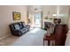 Inviting living room featuring a fireplace and comfortable leather sofa at 186 St. Andrews Ln, Chapel Hill, NC 27517