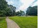 Community playground with various play structures, providing a fun and safe environment for children at 186 St. Andrews Ln, Chapel Hill, NC 27517