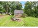 This cozy backyard is ready for entertaining with a deck and a fire pit at 1869 Brevard Rd, Graham, NC 27253