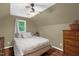 Bedroom featuring a low ceiling, hardwood floors, a ceiling fan, and a window illuminating the space at 1869 Brevard Rd, Graham, NC 27253