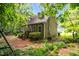 Charming home with lush greenery, dormer windows, and a cozy entrance at 1869 Brevard Rd, Graham, NC 27253