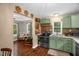 Cozy kitchen featuring painted cabinets, stainless steel appliances and connection to living area at 1869 Brevard Rd, Graham, NC 27253