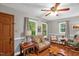 Comfortable living room with natural light, hardwood floors, and views of the yard at 1869 Brevard Rd, Graham, NC 27253
