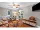 Inviting living room featuring wood floors and seamless access to kitchen at 1869 Brevard Rd, Graham, NC 27253