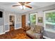 Bright living area boasting wood floors and seamless connection to other rooms at 1869 Brevard Rd, Graham, NC 27253