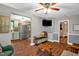 Open concept living space with hardwood floors and a view into the adjacent kitchen at 1869 Brevard Rd, Graham, NC 27253